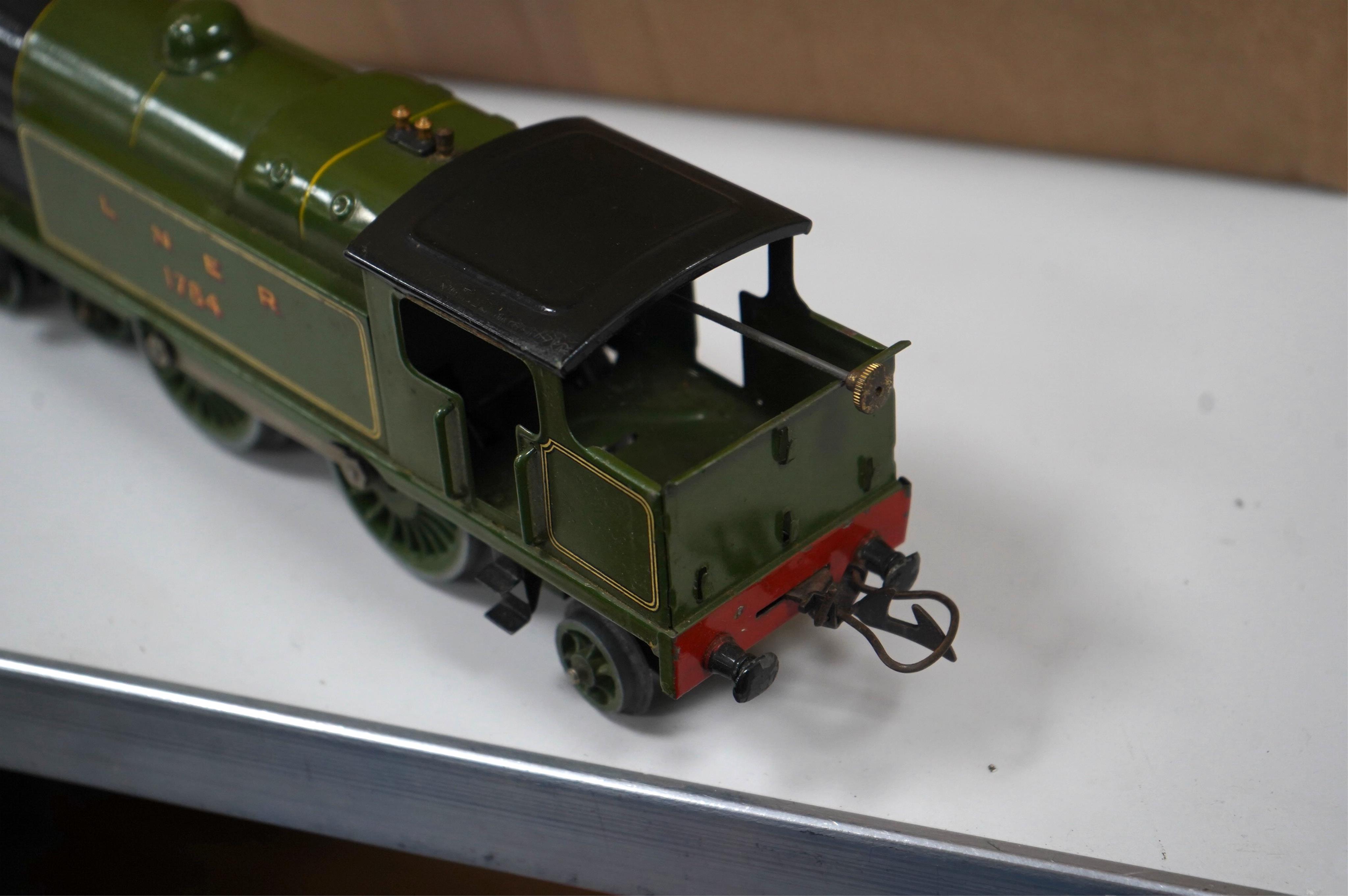 A collection of Hornby 0 Gauge tinplate railway including; a No.2 Special LNER 4-4-2T locomotive for three rail electric running, 1784, two boxed No.2 LNER teak Corridor Coaches, a boxed No.2 Lumber wagon, four freight w